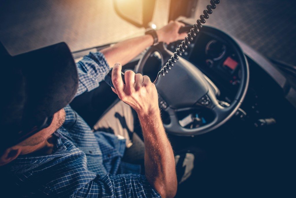 Truck driver using the radio