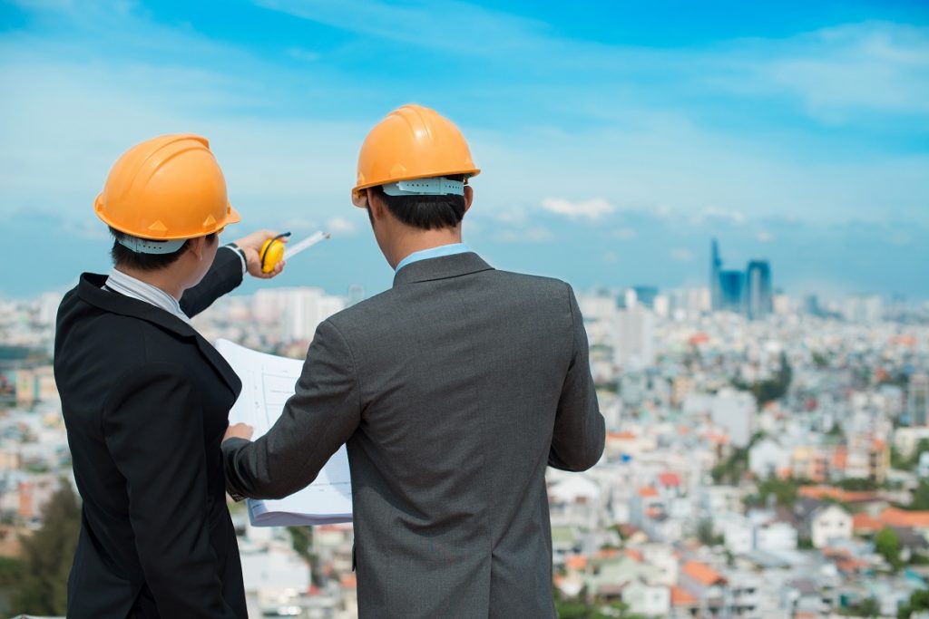 Businessmen looking at construction site