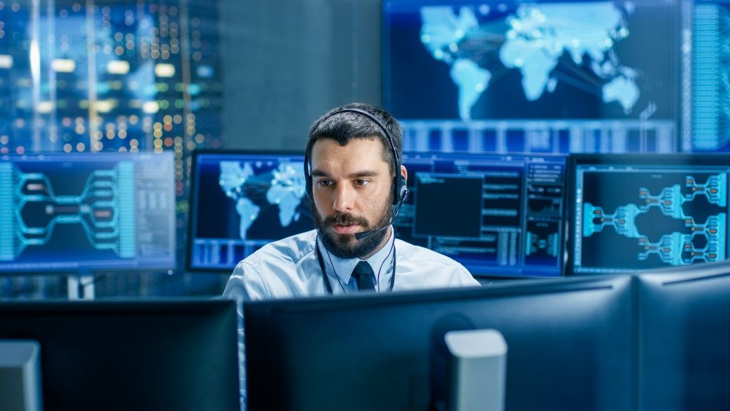 Man working in the system monitoring room