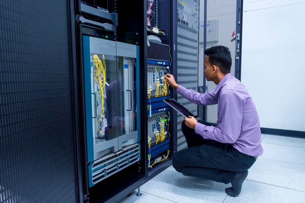 administrator working in data center room