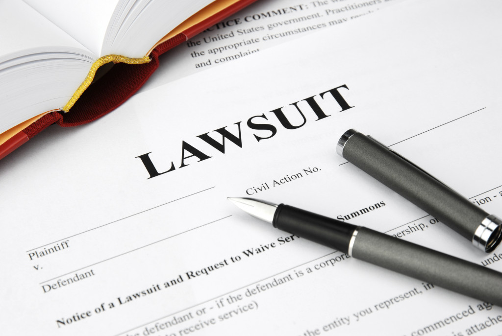 a lawsuit form and pen