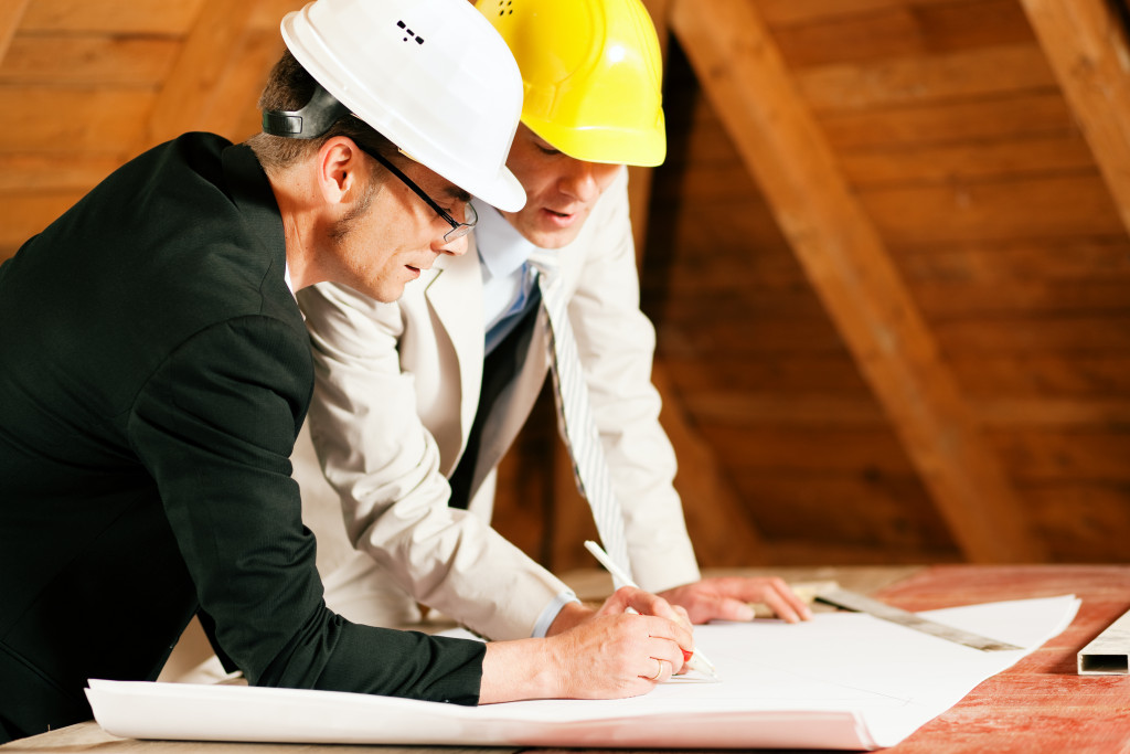 Construction employees making a blueprint